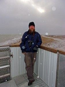 Rev Kane relaxing in the arctic snow flurries